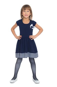 Little girl in blue dress standing with his legs apart - Isolated on white background
