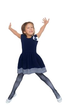 Cheerful Caucasian little girl in a short blue dress jumping . Girl photographed at the time of the jump - Isolated on white background