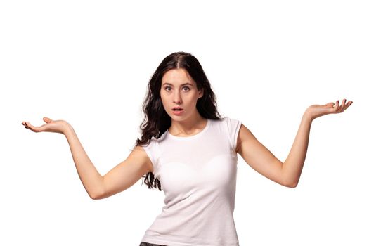 Beautiful, sweet, young girl spreads her arms on the white background