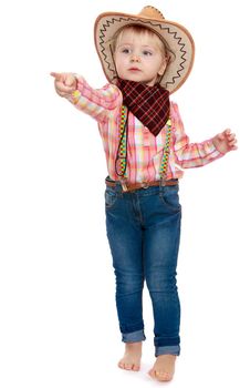 Nice little girl in jeans, a plaid shirt and a cowboy hat . Shows index finger to the side-Isolated on white background