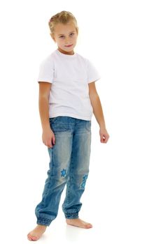 A little girl in full growth, in a pure white T-shirt and jeans. On the shirt you can put a logo or any other inscription. The concept of advertising on clothing, Happy childhood. Isolated on white background.