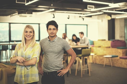 Portrait Of Successful Business couple Entrepreneur At Busy startup Office