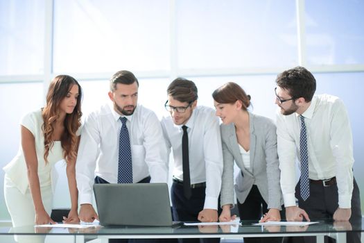 business team standing near the desktop.photo with copy space