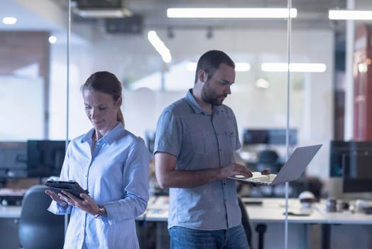 business couple working together on project at modern startup office