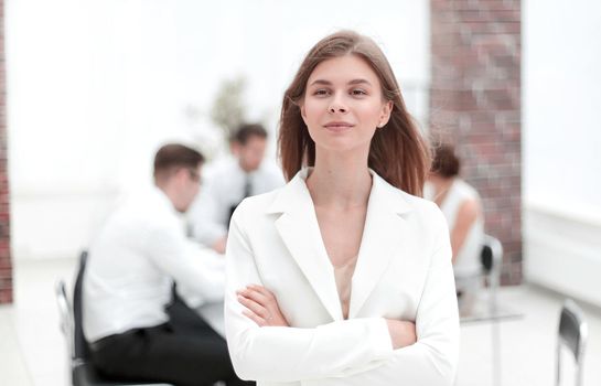 dreams of a young business woman standing in office.photo with copy space