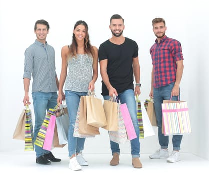 group of young people holding their shopping bags.isolated on white background