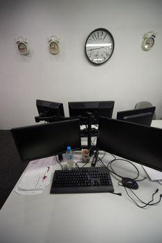 dual monitor screen and laptop computer at modern office indoors, startup company software develop  technology