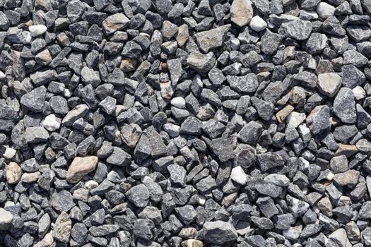 Crushed grey stone on the ground texture background