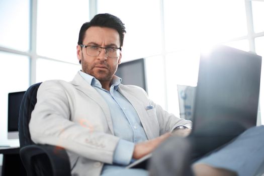 close up.a successful man with a laptop.people and technology