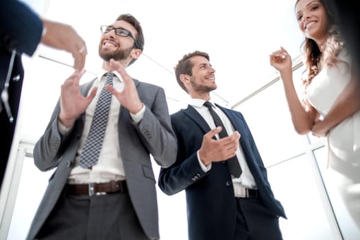 bottom view.group of business people standing in the office. business concept