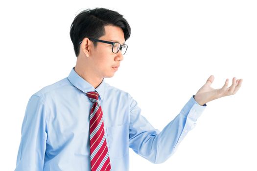 Male wearing blue shirt and red tie reaching hand out isolated on white background