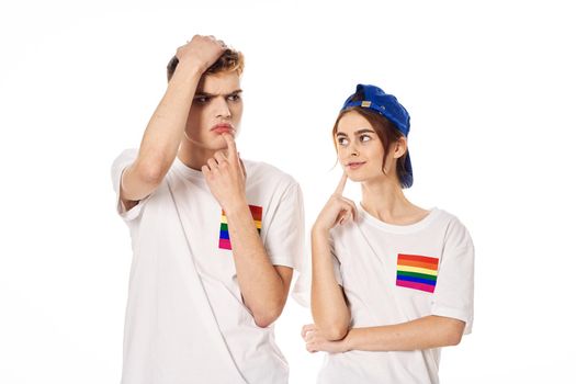 young couple lgbt Flag transgender community light background. High quality photo