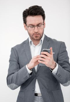 close up. business man reading an SMS on his smartphone.people and technology