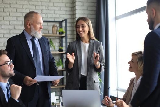 Portrait of a positive business employees at an office business meeting