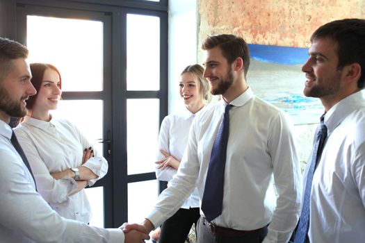 Business people shaking hands, finishing up a meeting