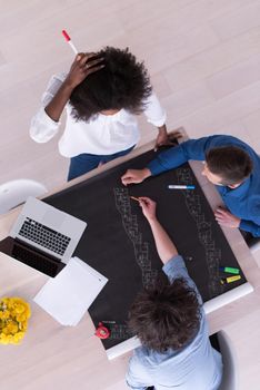 Multiethnic startup business team on meeting in modern bright office interior brainstorming, top view