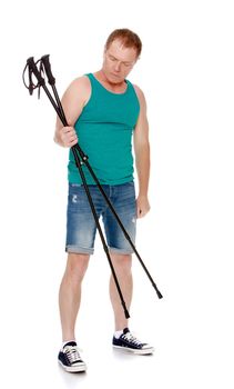 The concept of a healthy lifestyle and exercise.A 50 year old man involved in Nordic walking.Holds the sticks for Nordic walking.Isolated on white background