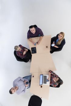 top view of multi ethnic startup business people group on brainstorming meeting in modern bright office interior