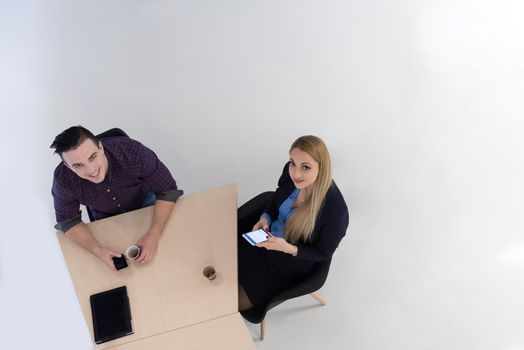 top view of multi ethnic startup business people group on brainstorming meeting in modern bright office interior