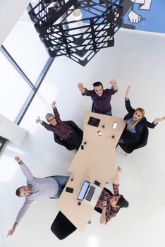 top view of multi ethnic startup business people group on brainstorming meeting in modern bright office interior