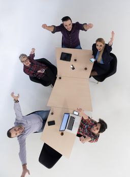 top view of multi ethnic startup business people group on brainstorming meeting in modern bright office interior