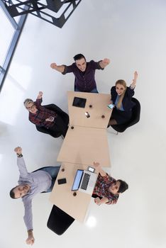 top view of multi ethnic startup business people group on brainstorming meeting in modern bright office interior