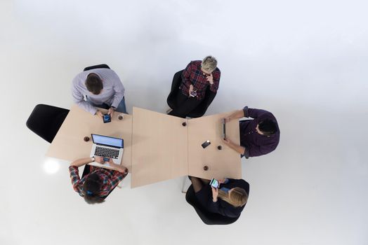 top view of multi ethnic startup business people group on brainstorming meeting in modern bright office interior