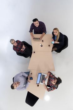 top view of multi ethnic startup business people group on brainstorming meeting in modern bright office interior