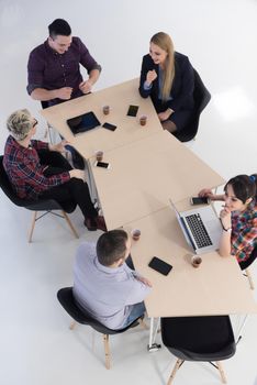 top view of multi ethnic startup business people group on brainstorming meeting in modern bright office interior