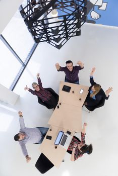 top view of multi ethnic startup business people group on brainstorming meeting in modern bright office interior