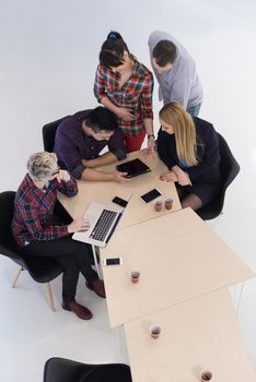 top view of multi ethnic startup business people group on brainstorming meeting in modern bright office interior