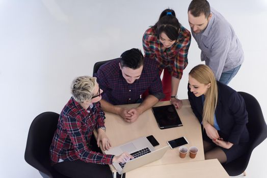 top view of multi ethnic startup business people group on brainstorming meeting in modern bright office interior