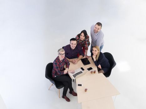 top view of multi ethnic startup business people group on brainstorming meeting in modern bright office interior