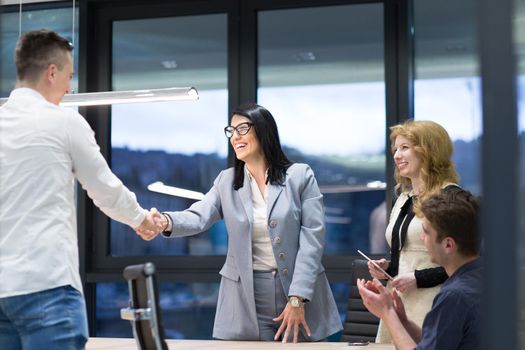 Business Partner Shake Hands on meetinig in modern office building