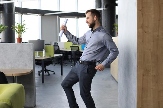 Excited business man celebrating success in the office