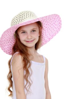 Beautiful little girl with long brown hair to her waist . The girl smiles sweetly turning sideways to the camera. Close-up - Isolated on white background - Isolated on white background