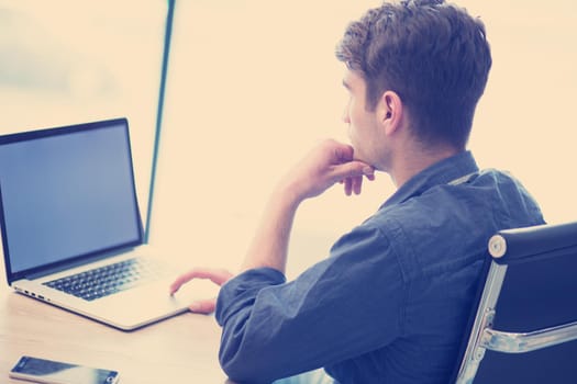 Young Entrepreneur Freelancer Working Using A Laptop In Coworking space