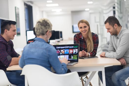 startup business team on meeting in modern bright office interior brainstorming, working on laptop and tablet computer