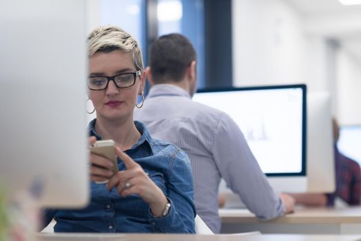 startup business, woman  working on dektop  computer at creative modern office relaxing and have fun