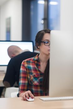 startup business, woman  working on dektop  computer at creative modern office relaxing and have fun