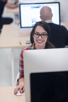 startup business, woman  working on dektop  computer at creative modern office relaxing and have fun