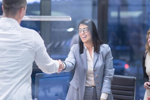 Business Partner Shake Hands on meetinig in modern office building