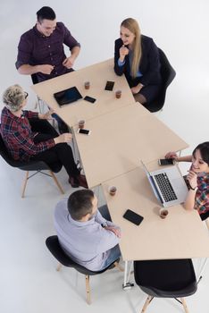 top view of multi ethnic startup business people group on brainstorming meeting in modern bright office interior