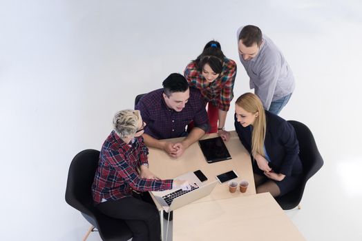 top view of multi ethnic startup business people group on brainstorming meeting in modern bright office interior