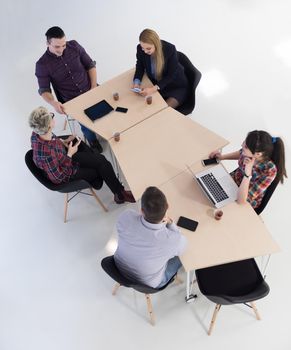 top view of multi ethnic startup business people group on brainstorming meeting in modern bright office interior