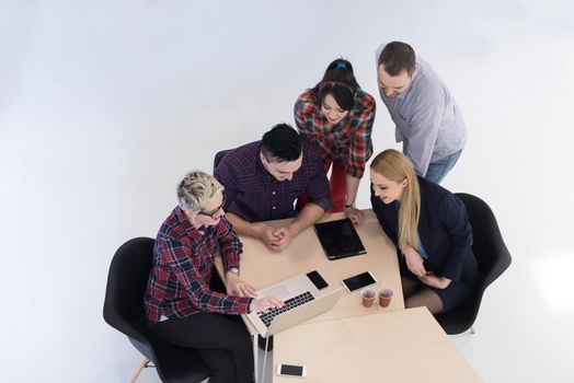 top view of multi ethnic startup business people group on brainstorming meeting in modern bright office interior