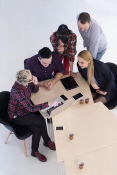 top view of multi ethnic startup business people group on brainstorming meeting in modern bright office interior