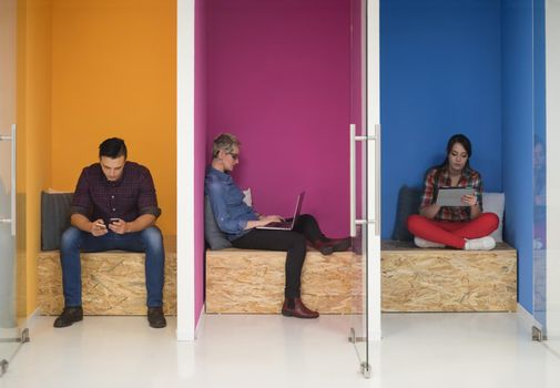 group of young business people having fun, relaxing and working in creative room space at modern startup office