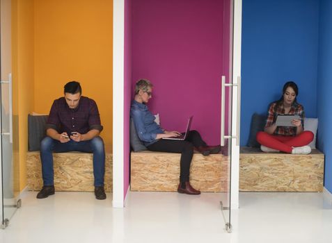 group of young business people having fun, relaxing and working in creative room space at modern startup office