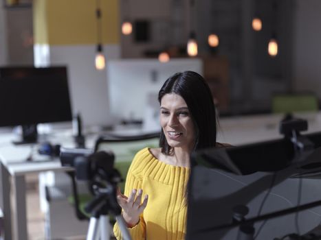 business woman have online meeting  in modern open space coworking office as influencer making podcat or tutorial videos